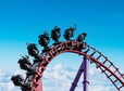 Roller coaster in the amusement park with the sunset background.