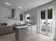 view of a modern kitchen with kitchen island overlooking on the terrace