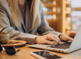 Woman working on a computer in a cafe